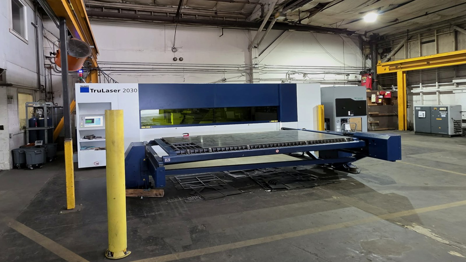 Laser cutting machine on a Washington manufacturer shop floor